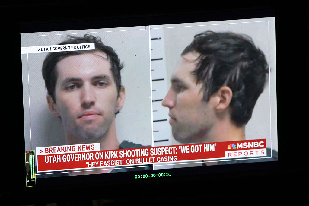 A TV monitor displays a picture of Tyler Robinson, the suspected of killing Charlie Kirk on September 11, in Orem, Utah, on September 12, 2025. US President Donald Trump on Friday announced that the suspect had been taken into custody over the killing of right-wing activist Charlie Kirk after a massive manhunt. (Photo by Patrick T. Fallon / AFP) (Photo by PATRICK T. FALLON/AFP via Getty Images)