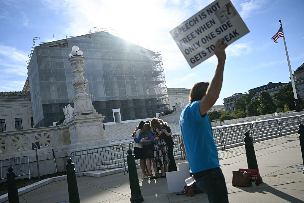 Members of the group "Concerned Women for America" pray outside the US Supreme Court as the Court hears oral arguements in Chiles v. Salazar, a landmark case on "conversion therapy," on October 7, 2025, in Washington, DC. The Supreme Court will hear a challenge today by a Christian therapist to a Colorado law that bans "conversion therapy" for minors who are questioning their gender identity or sexual orientation. The case was brought by Kaley Chiles, a licensed mental health counselor who argues that the prohibition from holding such conversations with minors is a violation of her First Amendment free speech rights. (Photo by ANDREW CABALLERO-REYNOLDS / AFP) (Photo by ANDREW CABALLERO-REYNOLDS/AFP via Getty Images)