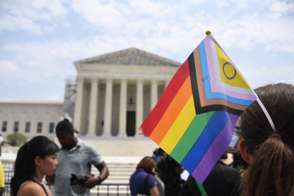 Gender rights activists demonstrate outside the US Supreme Court on June 30, 2023, in Washington, DC. The court ruled on June 30 that some private businesses can refuse service to same-sex couples for religious reasons, in a landmark erosion of anti-discrimination laws. The court backed the case of a Christian graphic designer from the state of Colorado who said that due to her beliefs she would not make a wedding website for a same-sex couple. (Photo by OLIVIER DOULIERY / AFP) (Photo by OLIVIER DOULIERY/AFP via Getty Images)