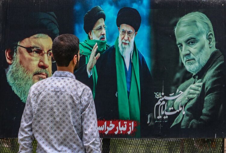 A man looks at a billboard featuring the portraits of (Left to Right) Hassan Nasrallah, the slain former leader of Hezbollah, Iran's late president Ebrahim Raisi, Iran's Supreme Leader, Ayatollah Ali Khamenei, and Iran's slain commander Qasem Soleimani, in Srinagar, Jammu and Kashmir, on June 17, 2025. Israeli Prime Minister Benjamin Netanyahu, in an interview with ABC News, states that killing Iran's Supreme Leader Ayatollah Ali Khamenei would end the conflict between the two countries. He also defends Israel's ongoing military actions against Iran, adding they aim to end the conflict rather than escalate it. His remarks come after reports that US President Donald Trump previously vetoed an Israeli plan to target Iran's Supreme Leader, fearing it could worsen the conflict. Israel continues its strikes across Iran since June 13, targeting nuclear and energy facilities, and a state television building in Tehran. In response, Iran launches waves of retaliatory missiles and drones toward Israel. (Photo by Firdous Nazir/NurPhoto via Getty Images)