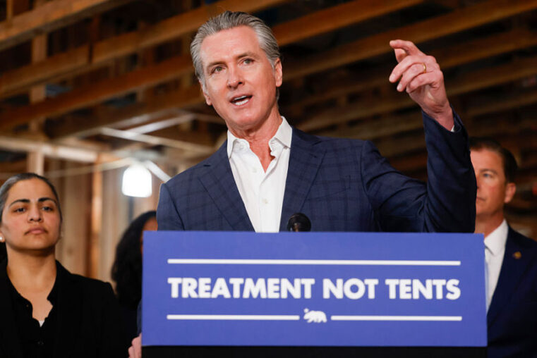 Governor Gavin Newsom speaks alongside local and state leaders during a press conference announcing new funding for communities across the state to address homelessness and mental health and stronger accountability measures for counties administering CARE Court during a press conference at BACS REGIS Center in Hayward, California Monday, March 2, 2026. (Photo by Jessica Christian/San Francisco Chronicle via Getty Images)